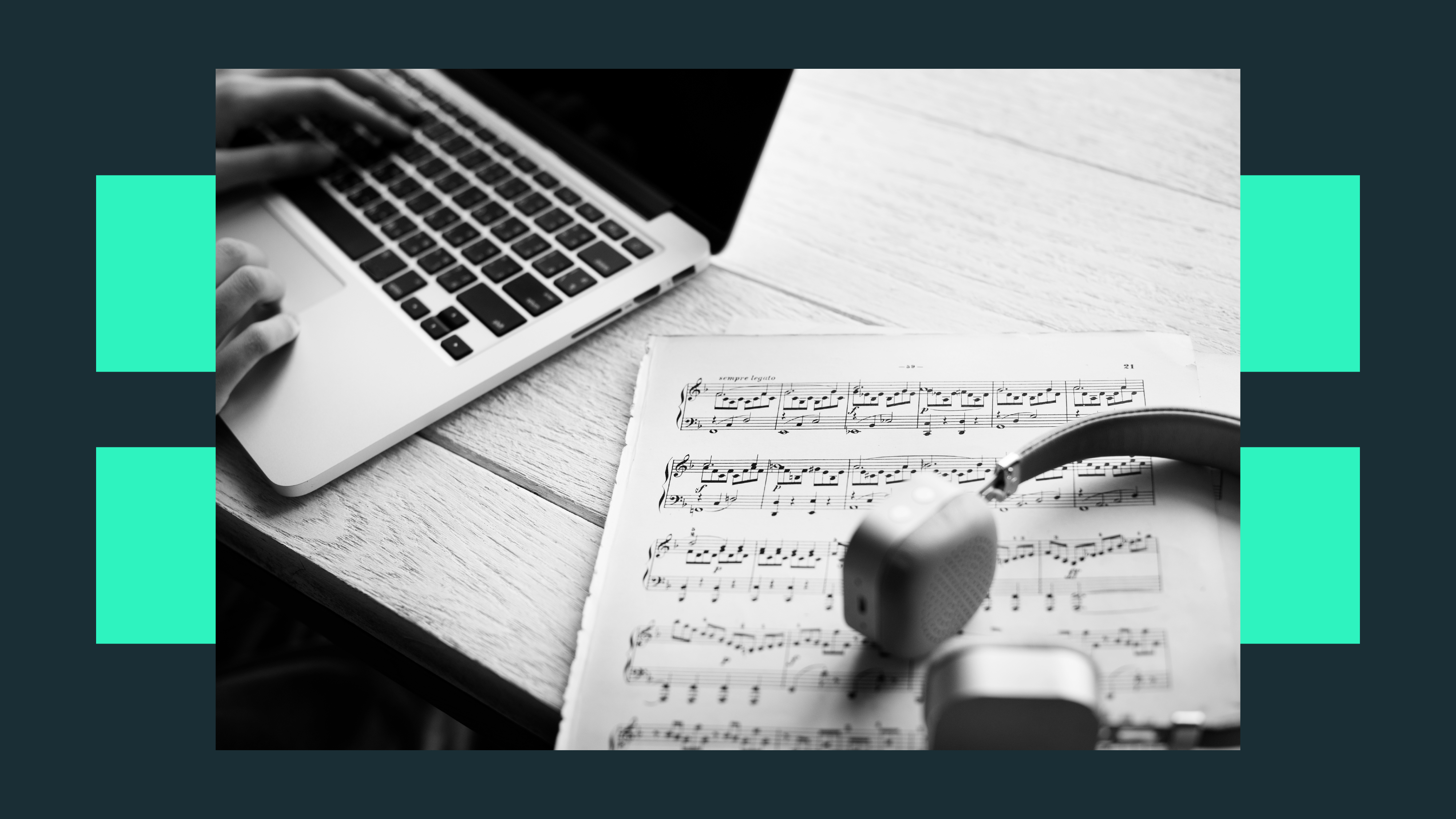 Person working on a laptop to obtain a music tutoring qualification, with sheet music and headphones beside them